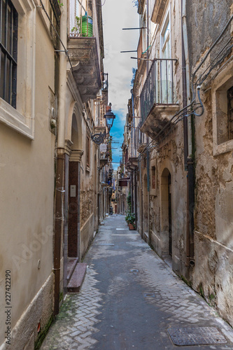 Narrow street Ortigia. Small island which is the historical centre of the city of Syracuse  Sicily. Italy.