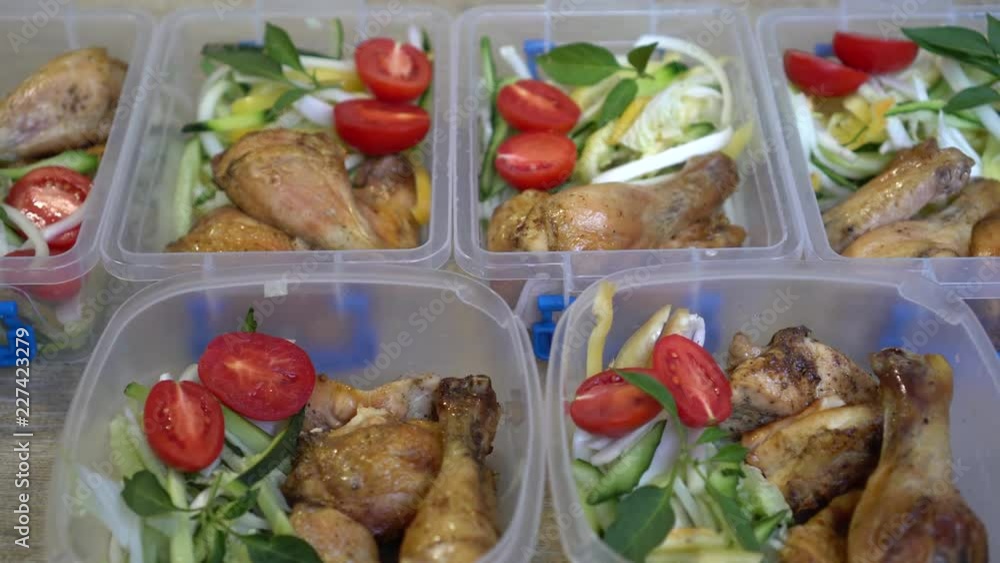 Weekly Meal Prep. Baked Chicken and Fresh Vegetables Salad In A Plastic Containers Weekly Meal Prep. Baked Chicken and Fresh Vegetables Salad In A Plastic Containers