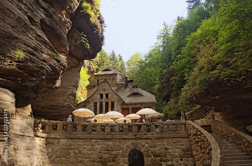 Hrensko, Czech Republic-AUGUST 23, 2018: Medieval building between the rocks in the forest. Bohemian Switzerland national park. Hrensko village is a small village on the border with Germany