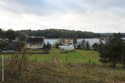 village in the lake. View in lake Losno . Pskov , Russia photo