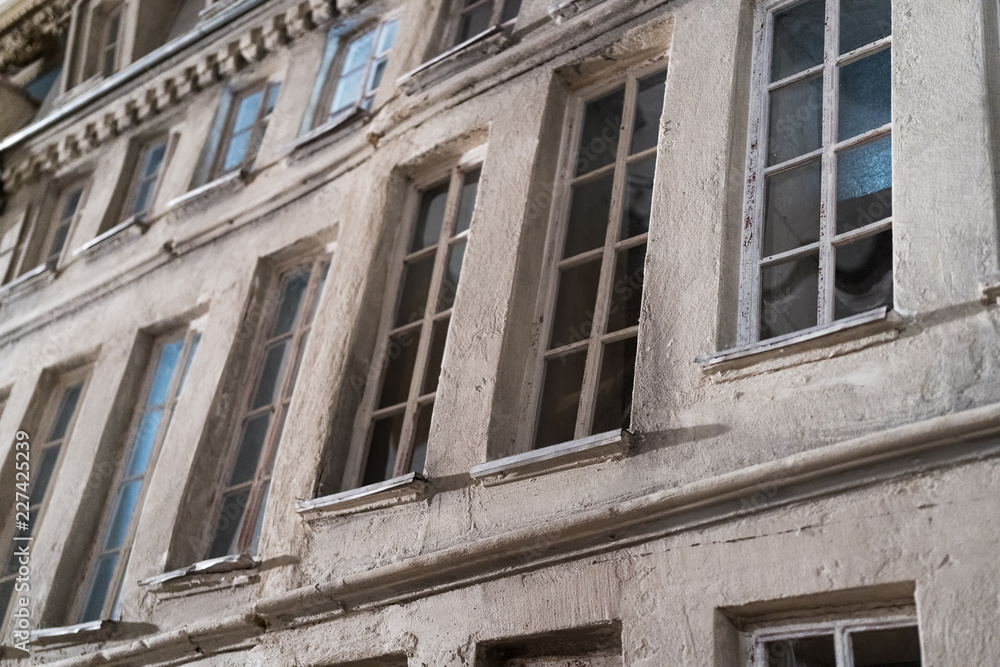 Closeup on a tenant house facade model with windows.