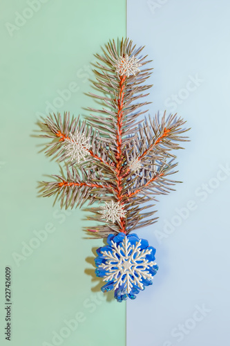 Background for cards for the New year with blue spruce branches and ornaments. Christmas card.  Top view. Copy space.    © golubka57