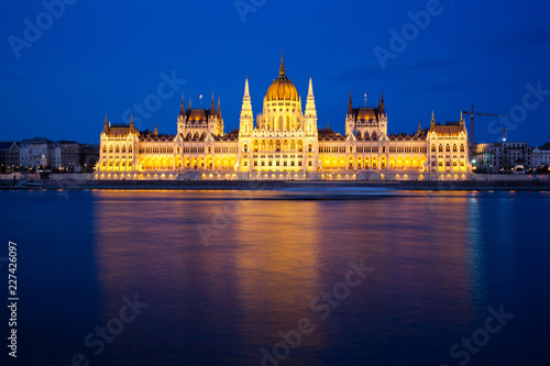 travel and european tourism concept. Budapest, Hungary. Hungarian Parliament Building over Danube River illuminated at night. © Melinda Nagy