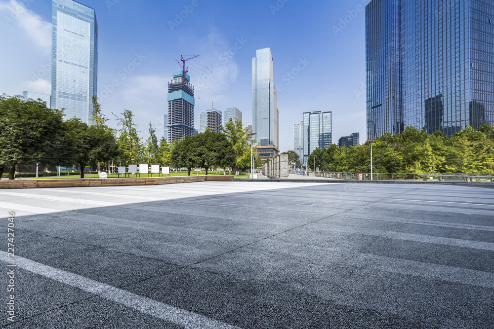 Panoramic skyline and modern business office buildings with empty road,empty concrete square floor