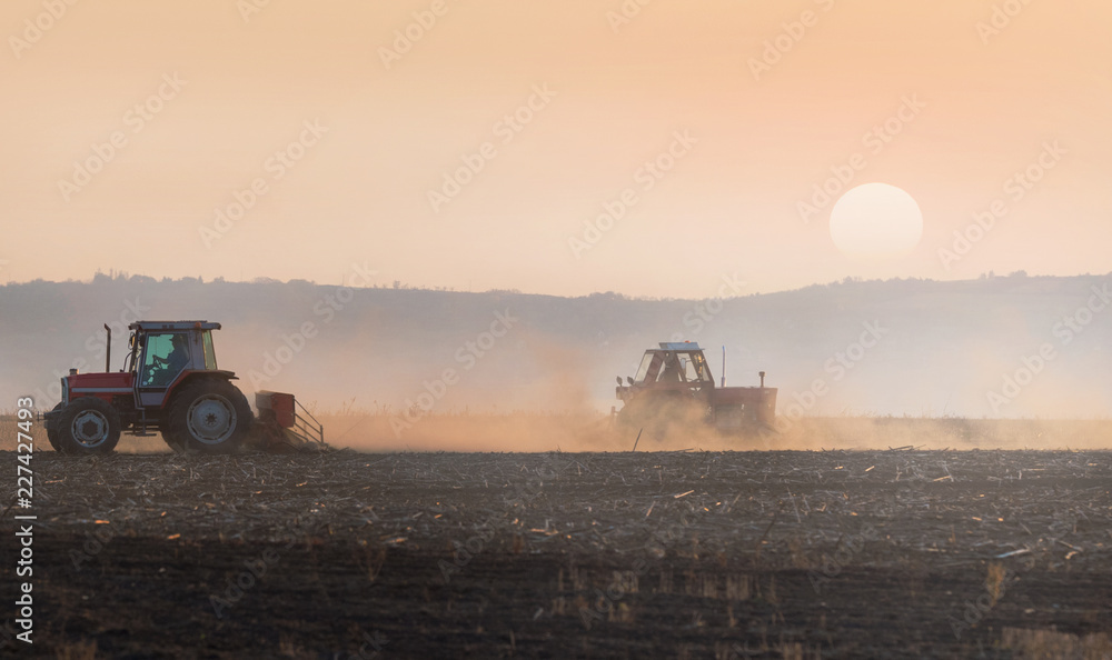Naklejka premium Plowing of stubble field