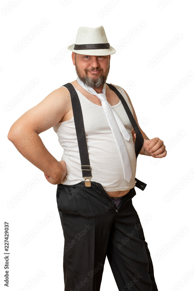A man in a hat and a t-shirt with a beer belly is smiling charmingly. A man in a hat and a t-shirt with a beer belly is smiling charmingly.
