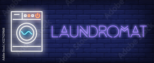 Laundromat neon sign. Washing machine on brick background. Laundry, housework, chores. Night bright advertisement. Vector illustration in neon style for hygiene, housekeeping, service