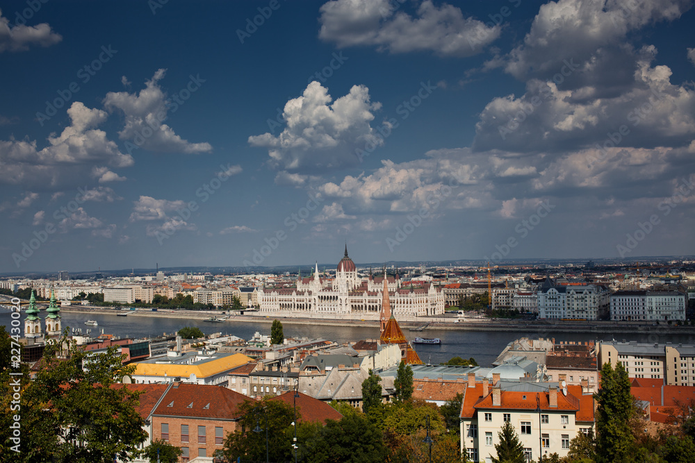 travel and european tourism concept. Budapest, Hungary. Hungarian Parliament Building over Danube River and Szechenyi chain bridge seen from Buda castle