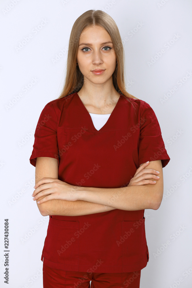Smiling young nurse or surgeon portrait isolated over white background. Smiling young nurse or surgeon portrait isolated over white background.