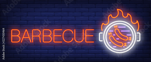 Barbecue neon sign. Sausages on barbecue grill with fire flame on brick wall background. Vector illustration in neon style for bbq restaurant and picnics