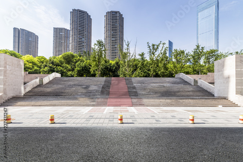 Panoramic skyline and modern business office buildings with empty road,empty concrete square floor © MyCreative