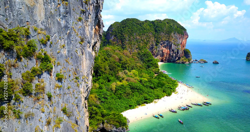 Photos Aerial Overhead View of Boats on Tropical Island Beach Surrounded by Rocky Cliff