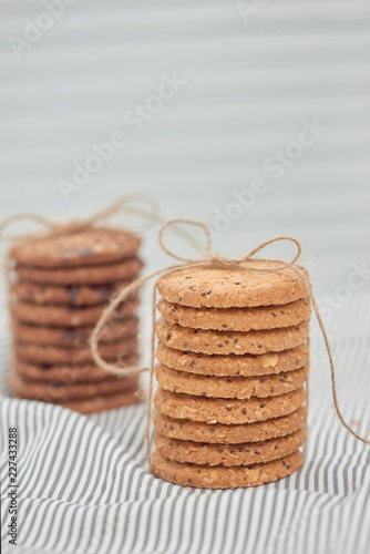 Cookie are stack and tied with twine. Delicious cookies on napkin background. Homemade cake. The nut cookie.