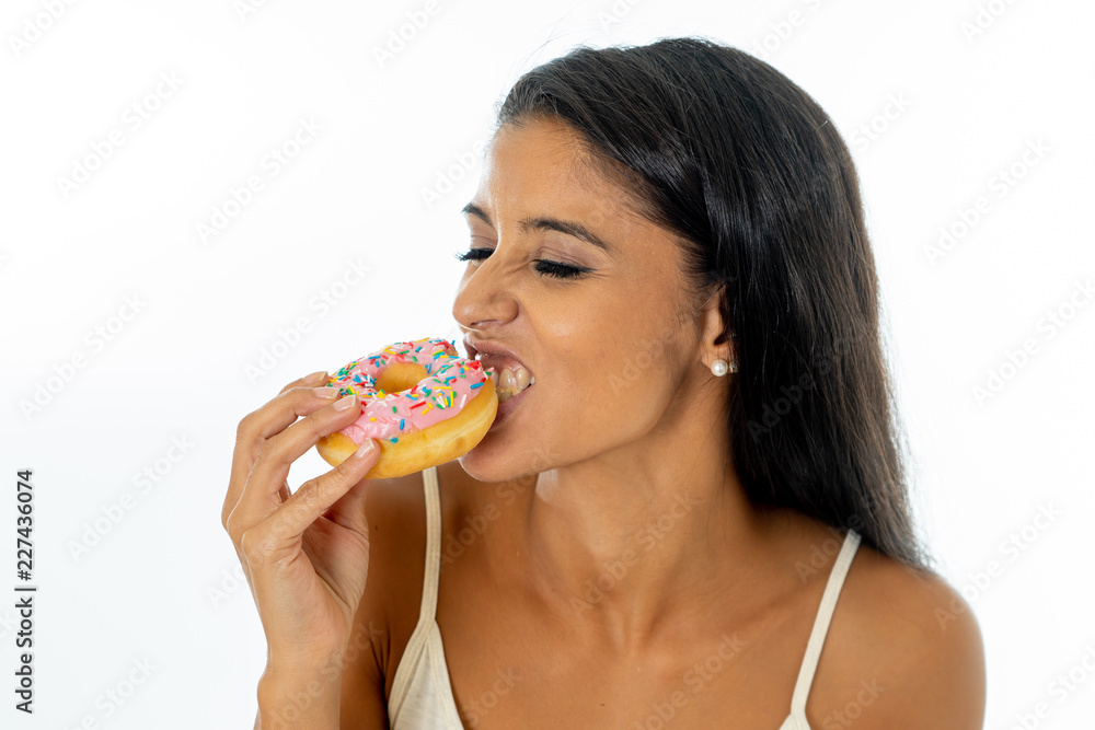 Portrait of attractive pretty girl eating tasty donuts isolated over white background Portrait of attractive pretty girl eating tasty donuts isolated over white background