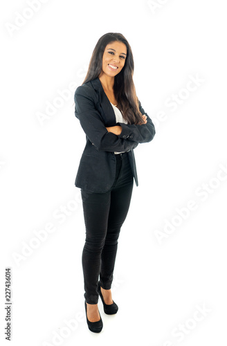Full body portrait of a attractive businesswoman looking happy and successful