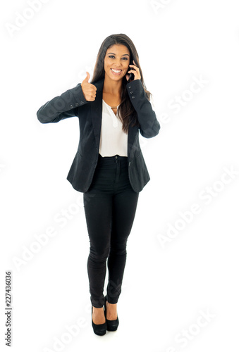 Full body portrait of happy excited beautiful businesswoman