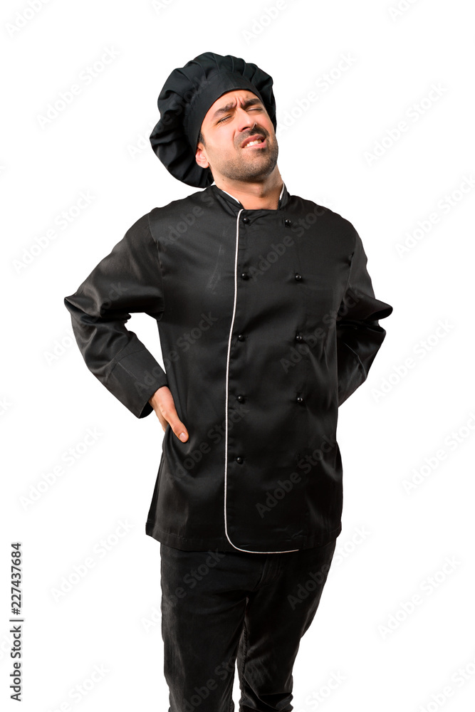 Chef man In black uniform unhappy and suffering from backache for having made an effort on isolated white background Chef man In black uniform unhappy and suffering from backache for having made an effort on isolated white background