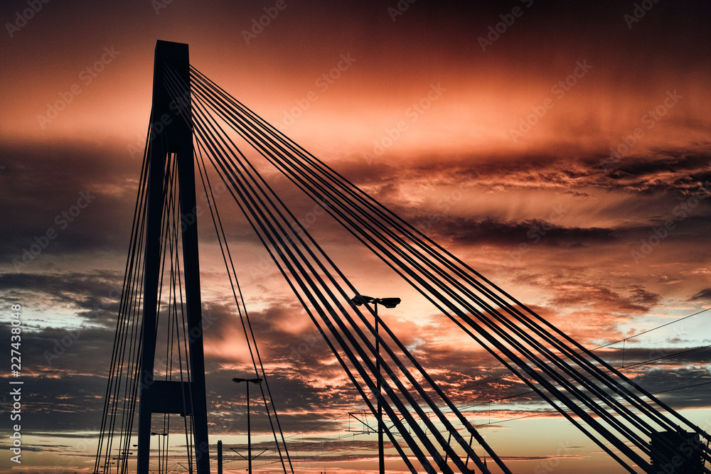 Obraz premium Mannheim Ludwigshafen Germany Bridge red dramatic sky siluette black