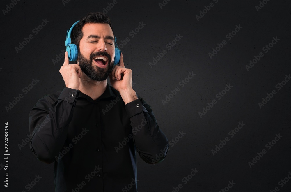 Handsome man with beard on black background Handsome man with beard on black background