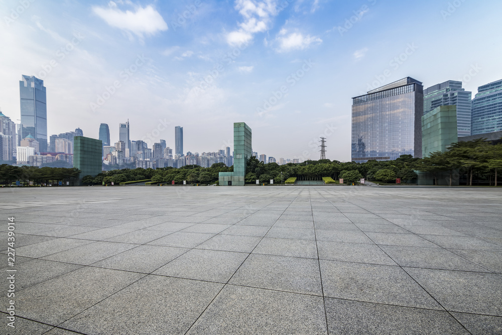 Panoramic skyline and modern business office buildings with empty road,empty concrete square floor