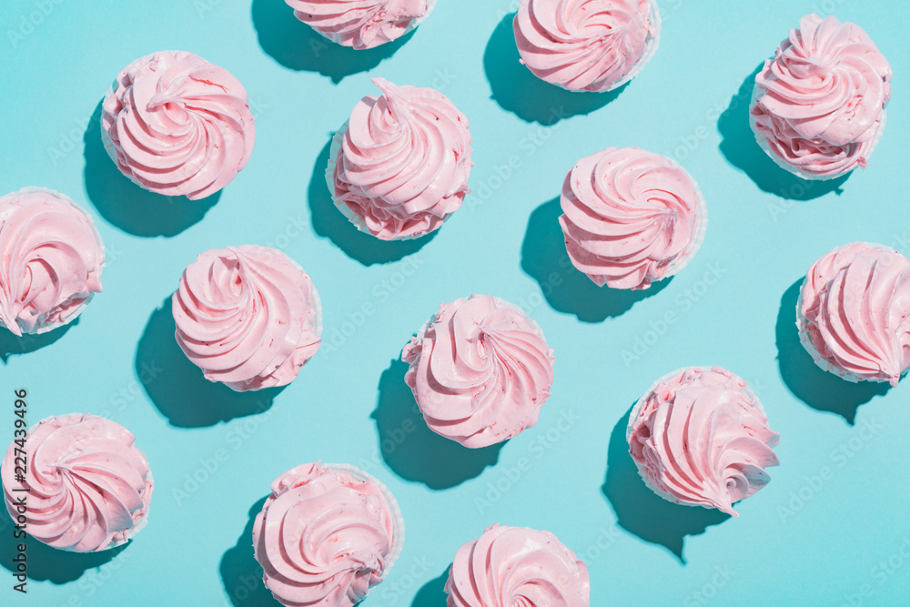 Pink cupcakes on blue background Stock Photo | Adobe Stock