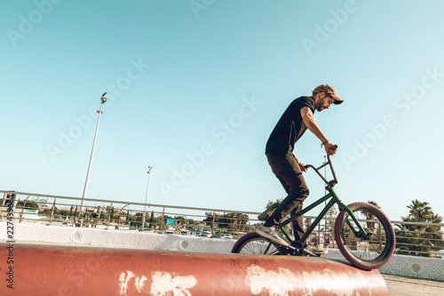 BMX rider doing tricks in the streets