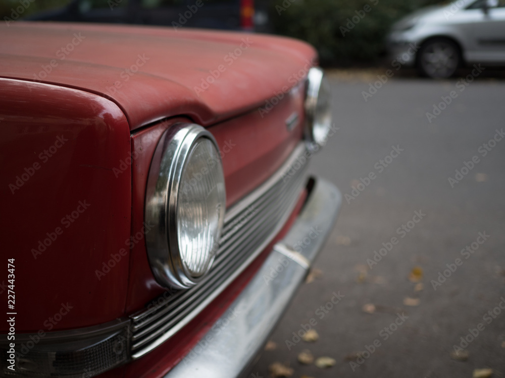 Frontlights of a red car