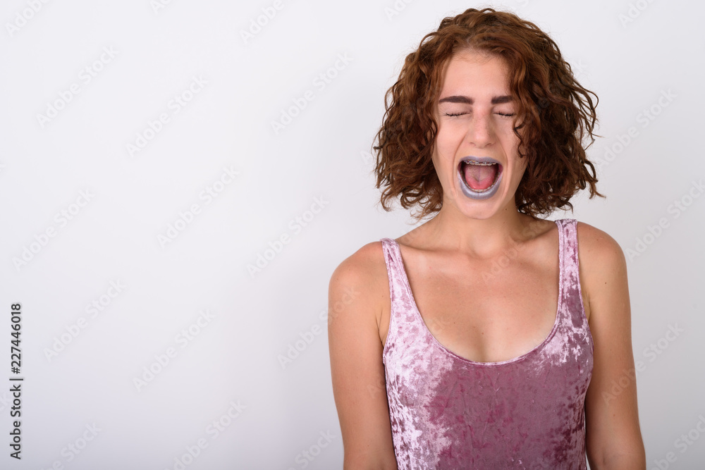 Portrait Of Young Woman Against White Background Portrait Of Young Woman Against White Background