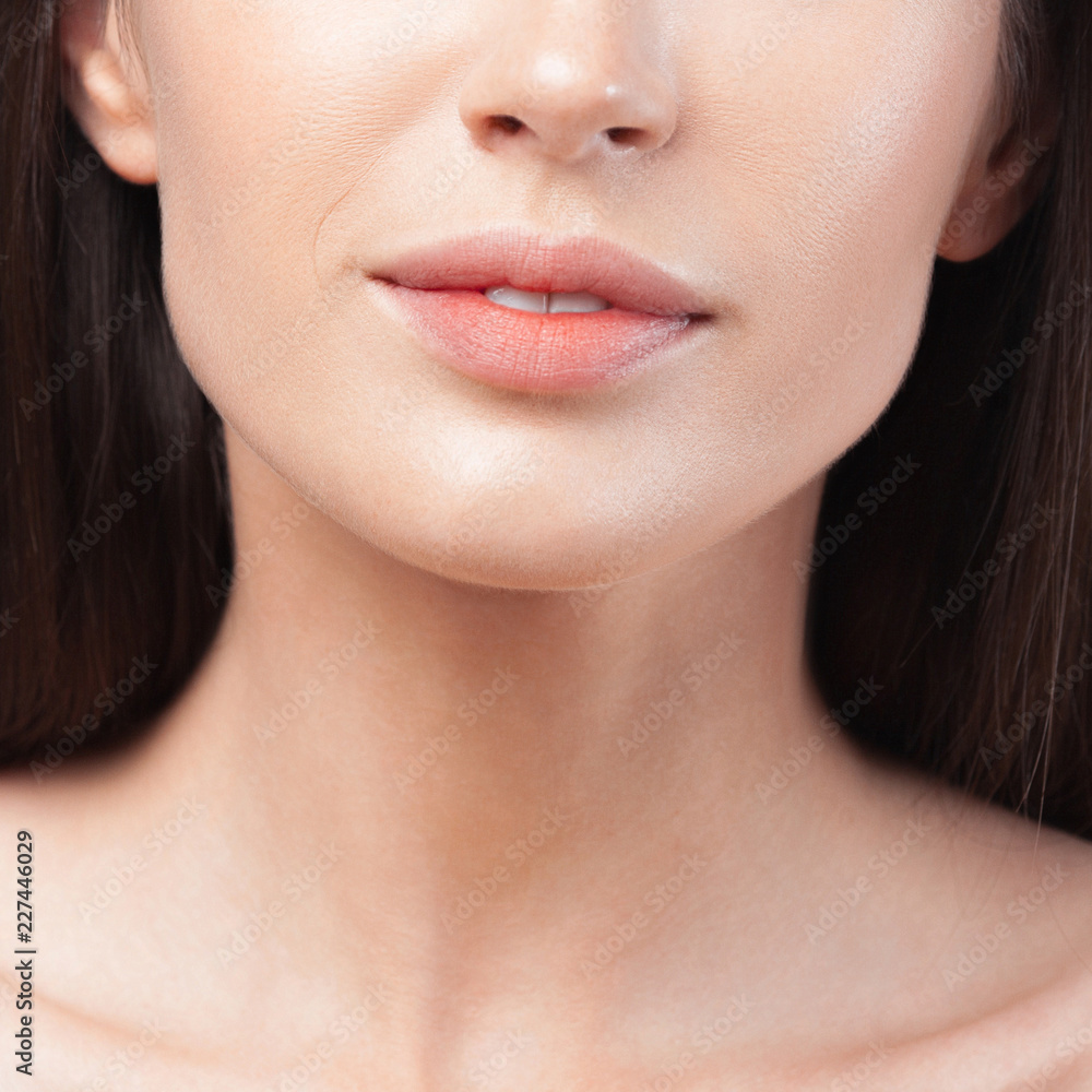Plump sensual lips of young beautiful woman close up Plump sensual lips of young beautiful woman close up