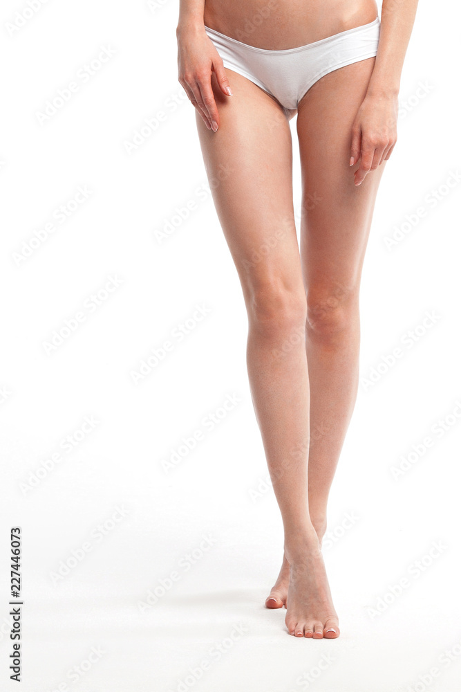 Beautiful smooth legs of young woman close-up Beautiful smooth legs of young woman close-up