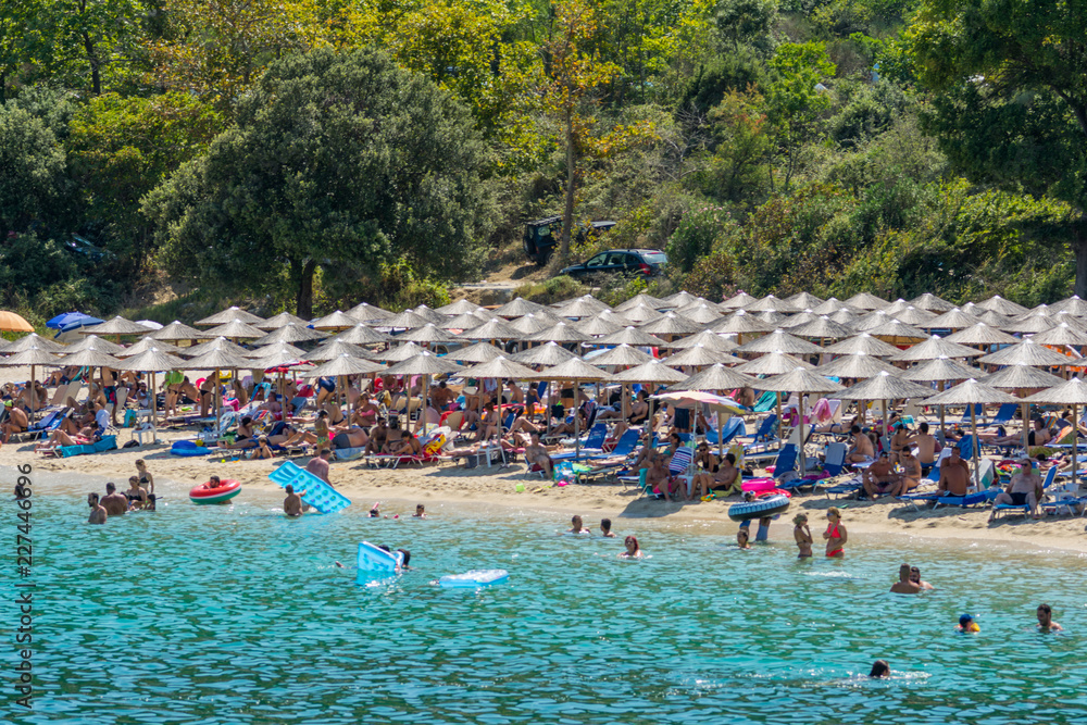 Fototapeta premium Olympiada, Greece - August 18, 2018: Proti Ammoudia beach, one of the most beautiful beaches in the Aegean Sea.