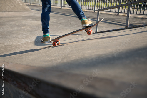 Skateboarder skateboarding at skatepark