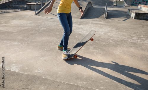 Skateboarder skateboarding at skatepark