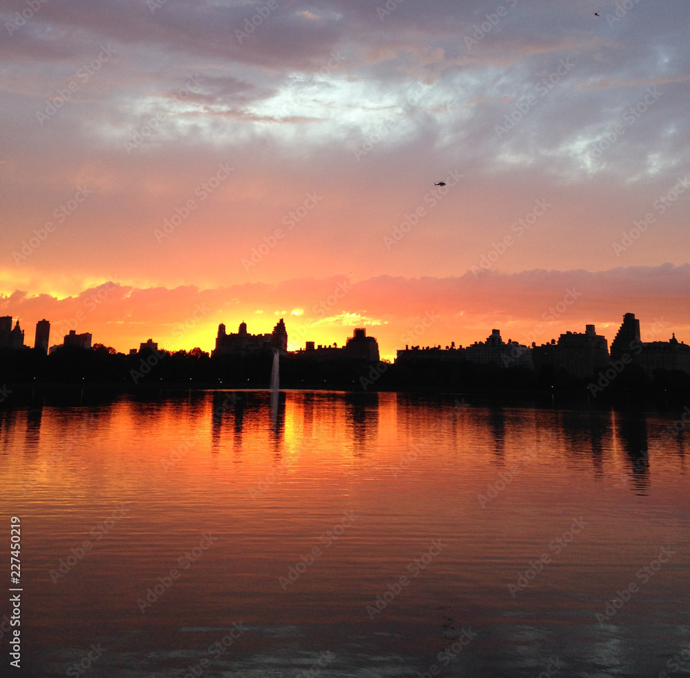 Gorgeous sunset at reservoir in Central Park, New York City, NY