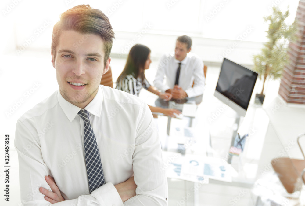 successful businessman on background of office. successful businessman on background of office.