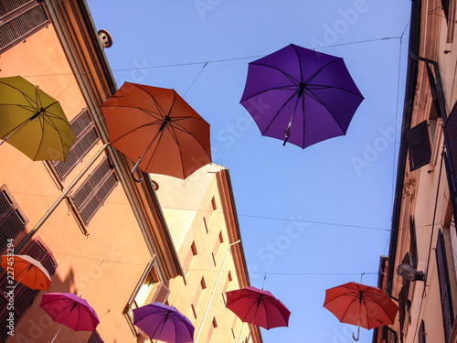 Colorful umbrellas floating in the air