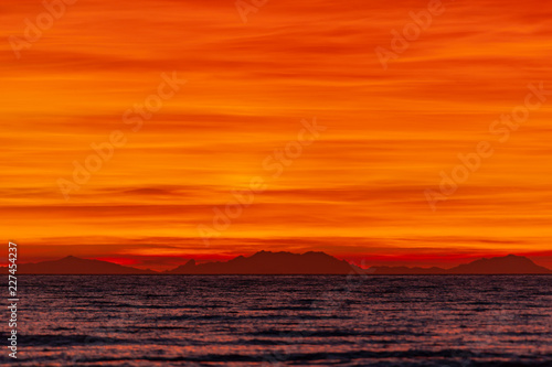 The burning sunset over the sea in natural park Maremma in Tuscany  Italy