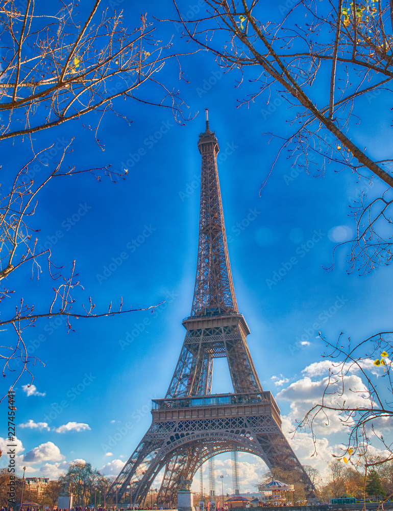 The Eiffel Tower in paris on a beautiful sunny day. View from Seine promenade