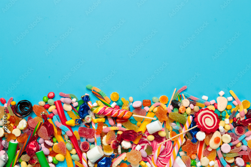 colored candies on blue background