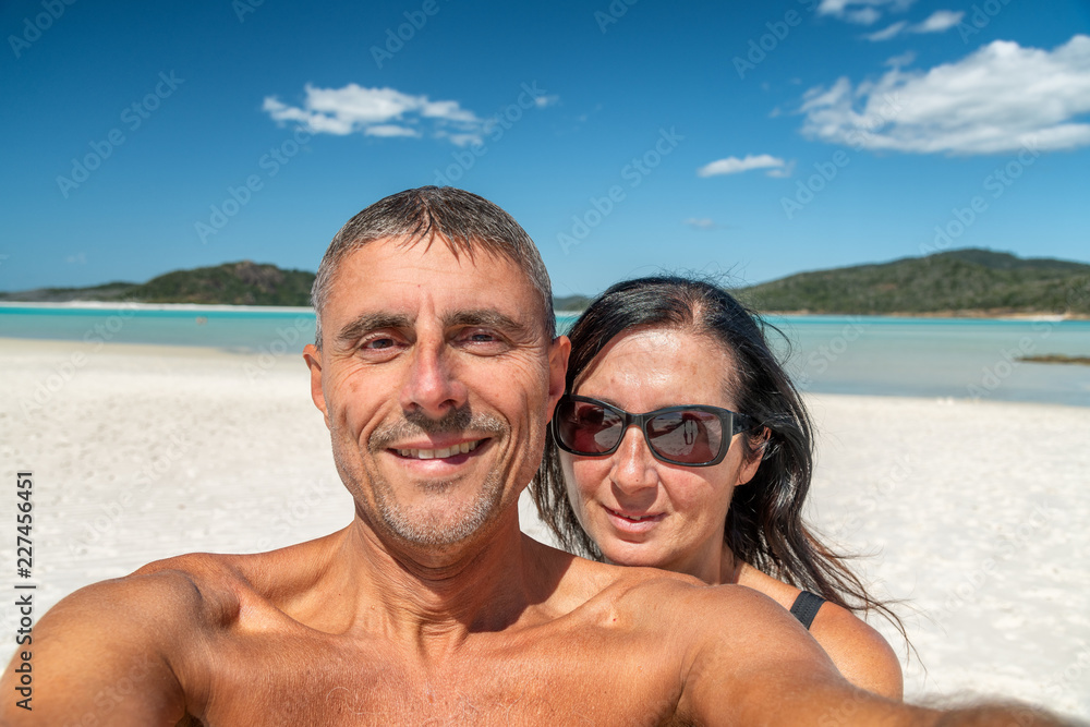 Happy couple in the 40s during a ocean holiday. Travel concept Happy couple in the 40s during a ocean holiday. Travel concept