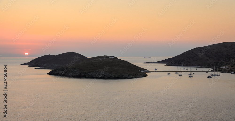Beautiful sunset of Kolona double bay Kythnos island, Cyclades, Greece.