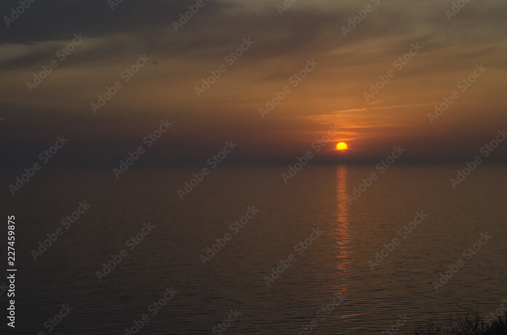 Beautiful sunset over the sea. Bright sunset sky with clouds. Black sea, Anapa, Krasnodar region, Russia Beautiful sunset over the sea. Bright sunset sky with clouds. Black sea, Anapa, Krasnodar region, Russia