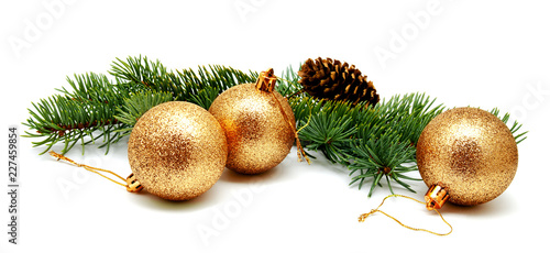 Christmas decoration golden yellow balls with fir cones and fir tree branches isolated