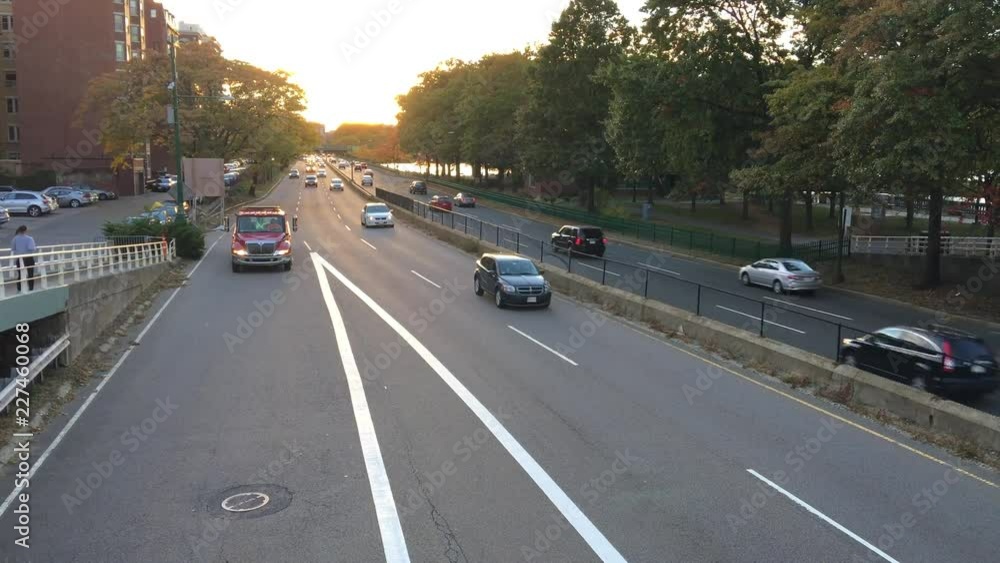 BOSTON, MA - OCTOBER 2015: City traffic at sunset. Boston attracts 20 million tourists every year BOSTON, MA - OCTOBER 2015: City traffic at sunset. Boston attracts 20 million tourists every year