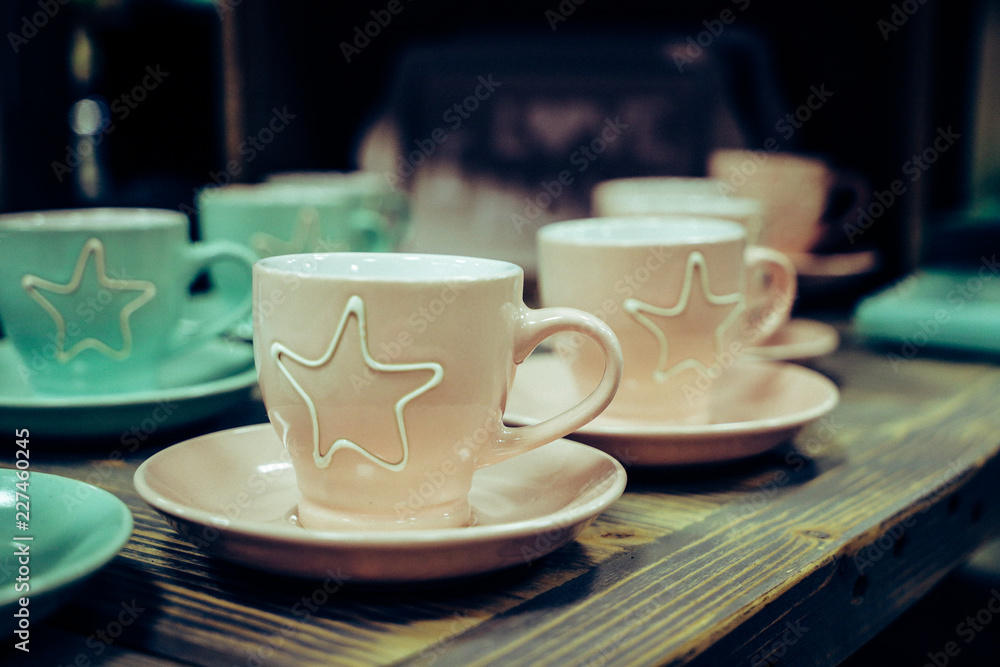 colored empty coffee cups on a table colored empty coffee cups on a table