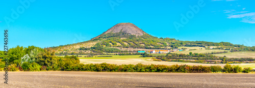 Oblik hill in the middle of Ceske Stredohori, aka Central Bohemian Highlands. Landscape with typical spiky hills of volcanic origin, Czech Republic. photo