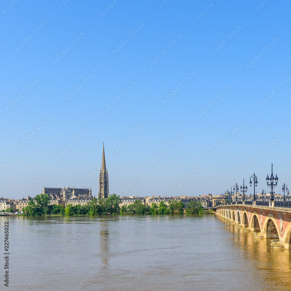 Saint Pierre bridge crossing Garonne river at Bordeaux, France. Copy space for text.