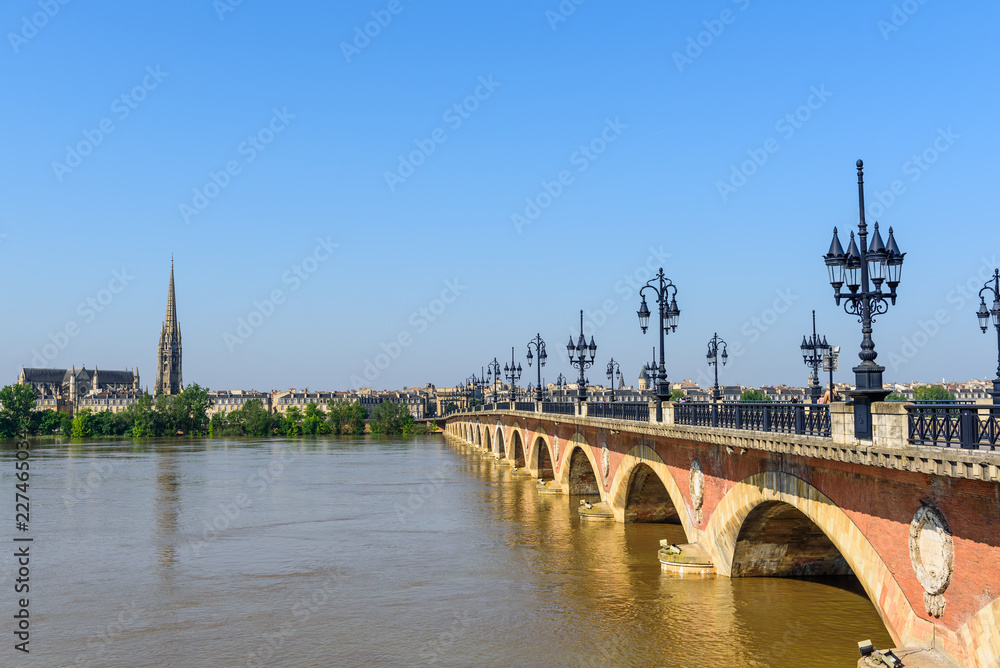 Saint Pierre bridge crossing Garonne river at Bordeaux, France. Copy space for text.