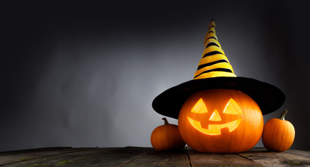 Halloween pumpkin with witches hat