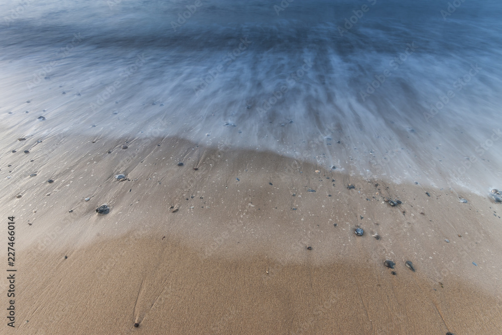 Waves on the beach with pebbles Waves on the beach with pebbles